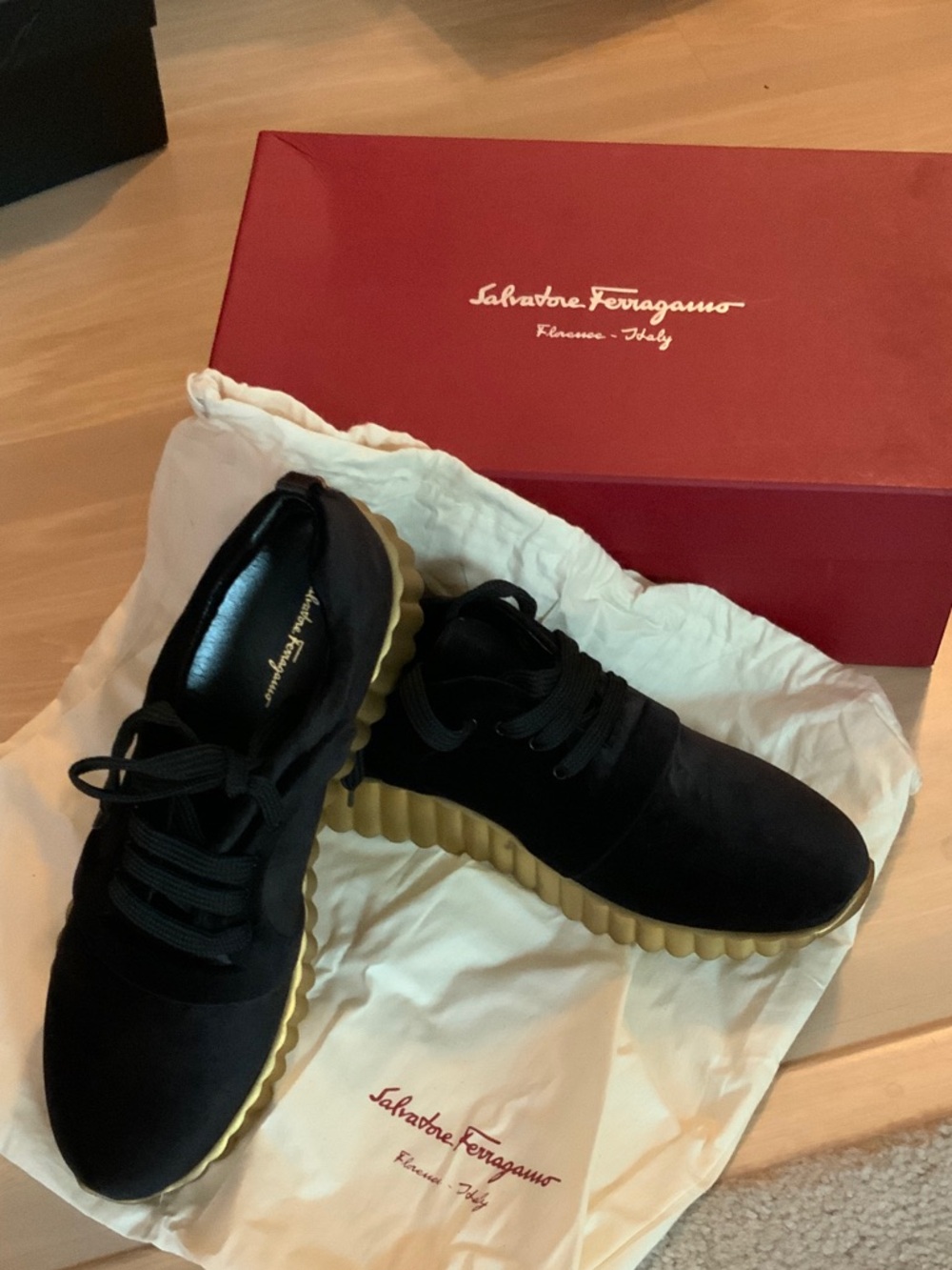 Salvatore Ferragamo Black Sneakers with Gold Ribbed Sole